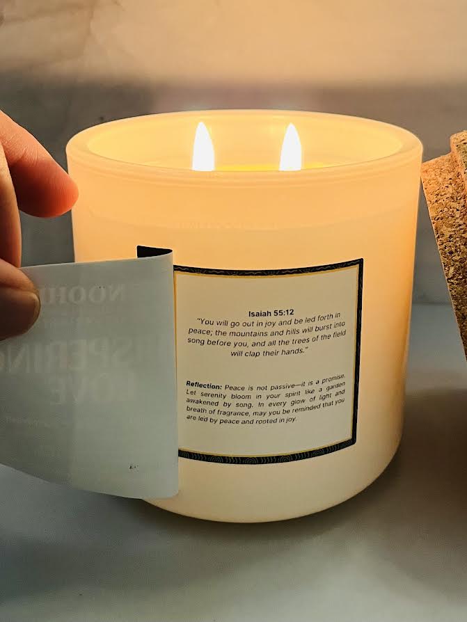 A candle that says Whispering Love