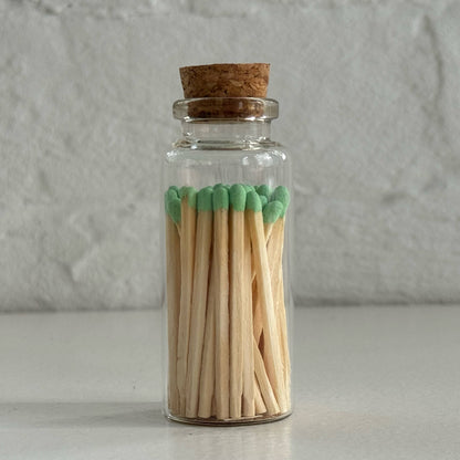 Match in a glass vial with cork - green