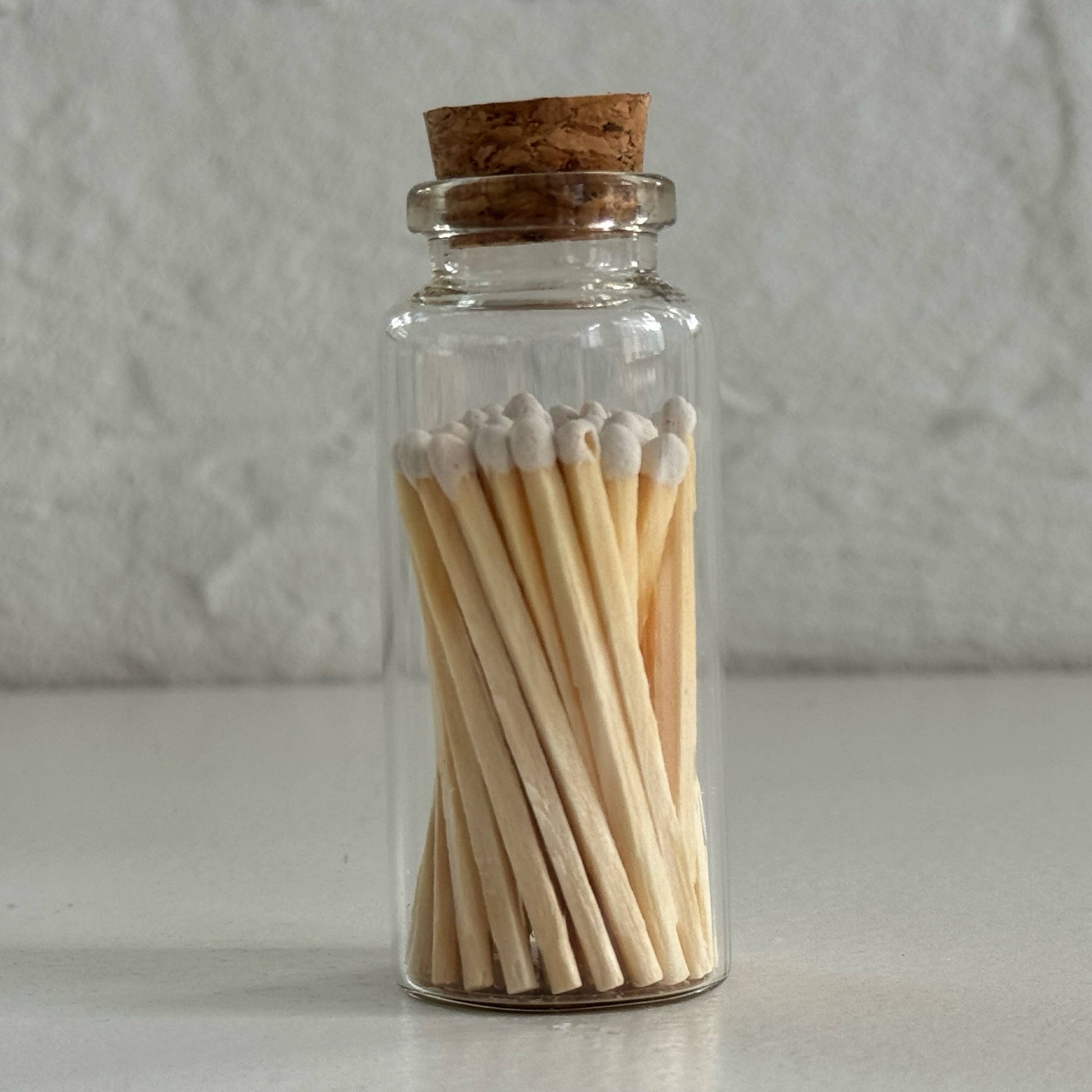 Match in a glass vial with cork - white