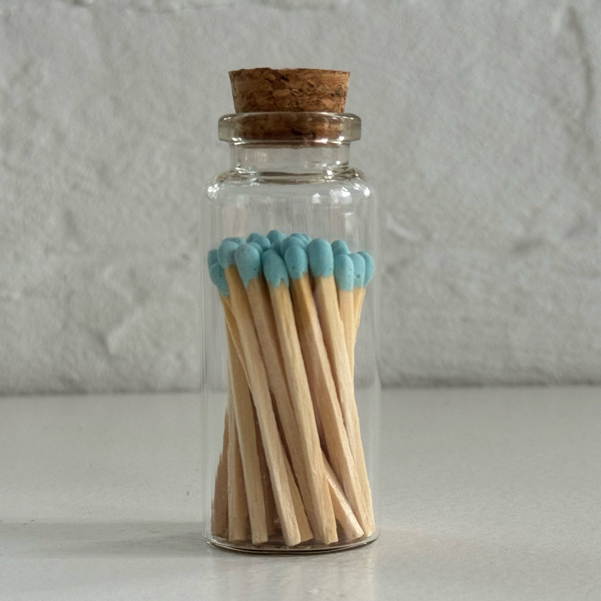 Match in a glass vial with cork - turqouise